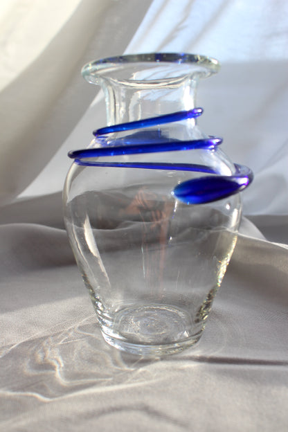 Clear vase with blue decoration