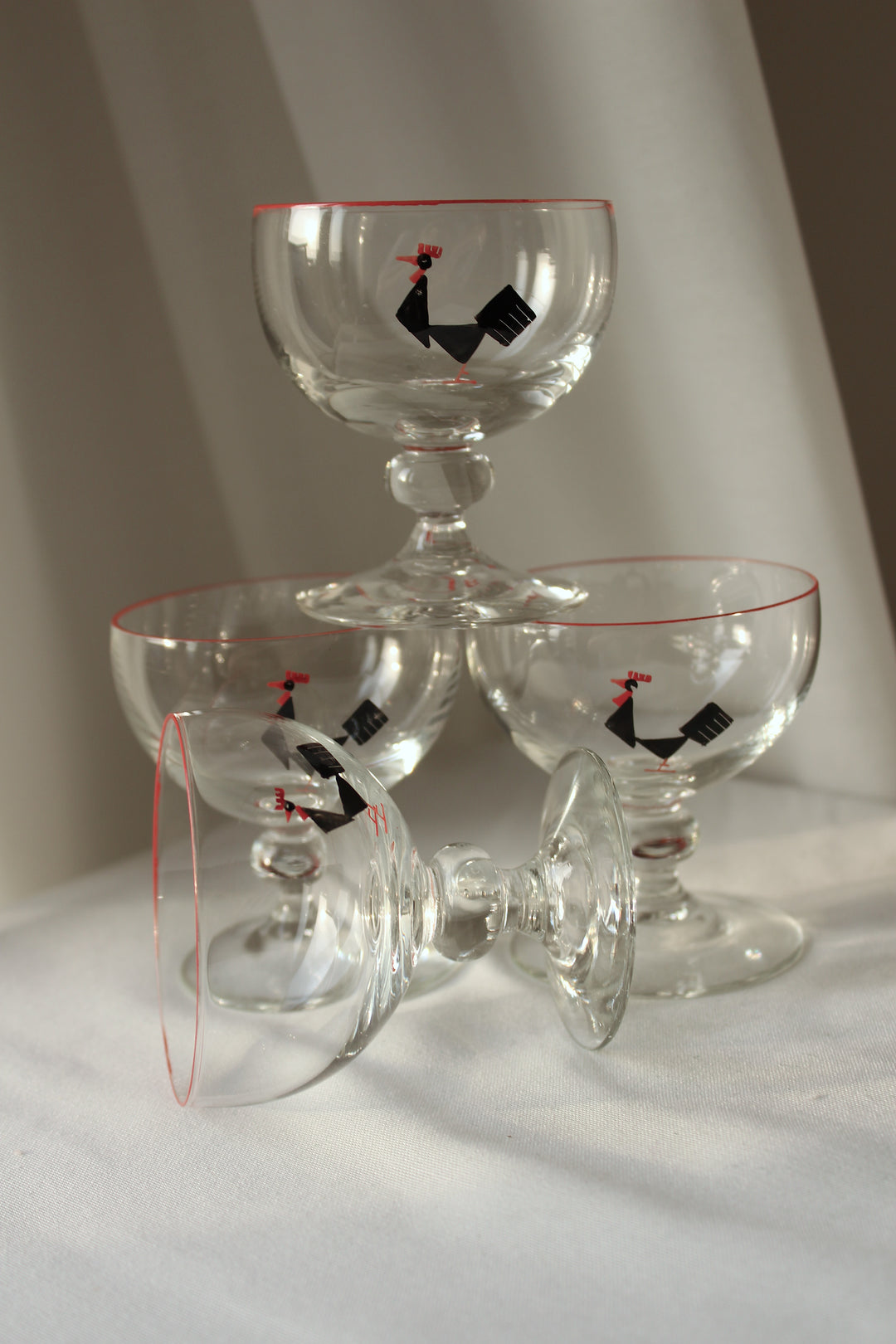 Holmegaard - Cocktail glass with enamel painted black tap, red rim.