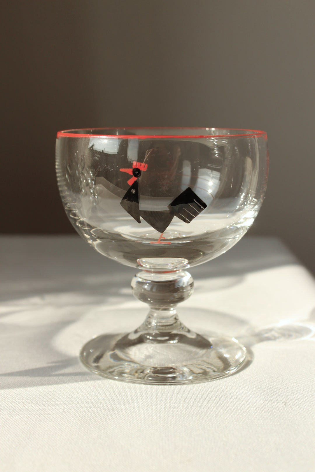 Holmegaard - Cocktail glass with enamel painted black tap, red rim.