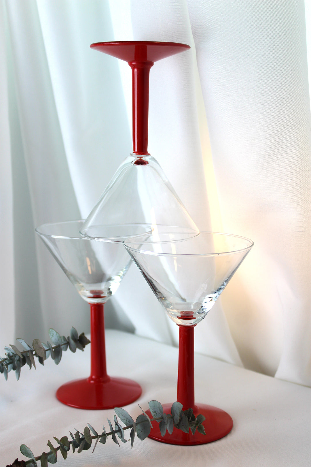 Cocktail glass with red stem