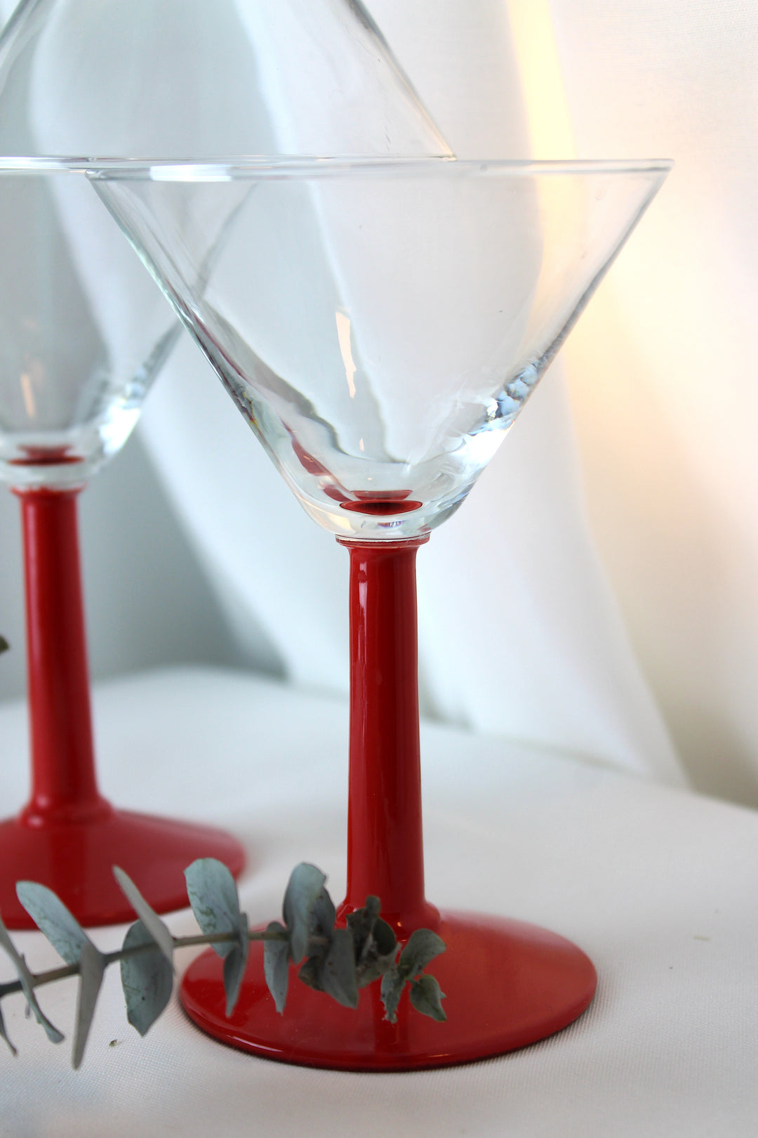 Cocktail glass with red stem