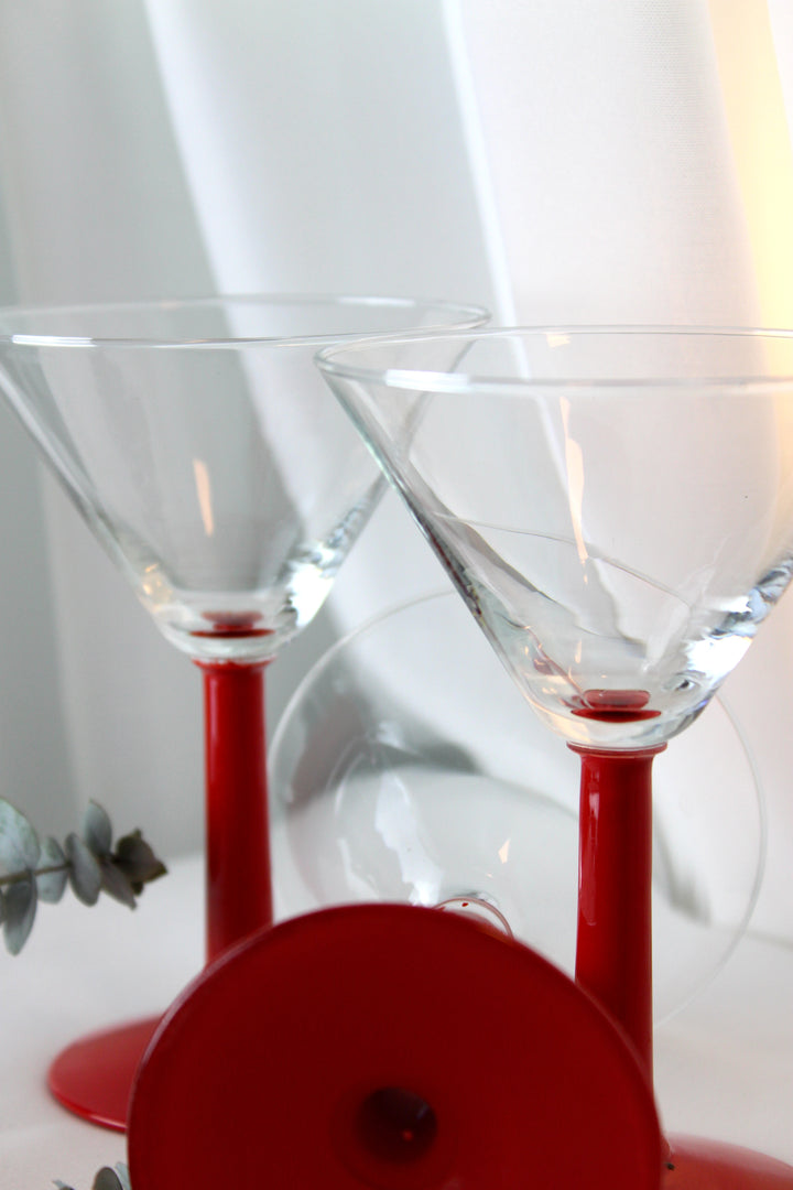 Cocktail glass with red stem