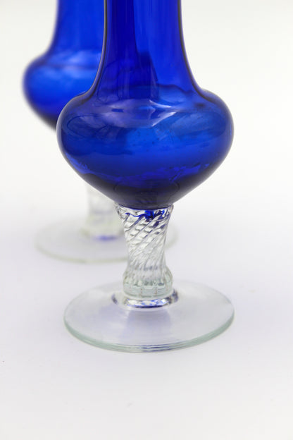 Blue vases with swirl feet